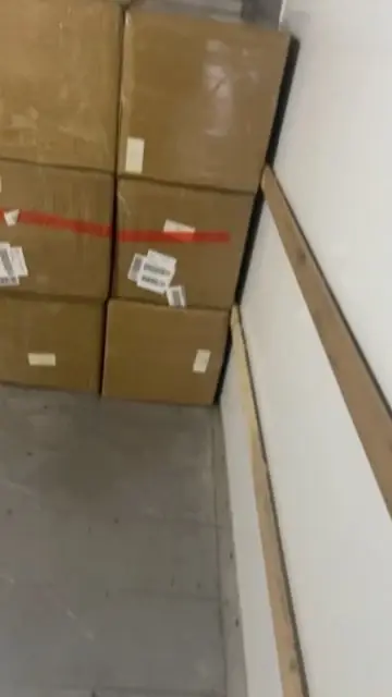 Boxed inventory stacked at the warehouse